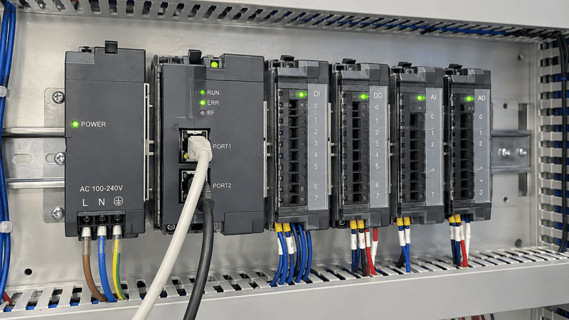 PLC rack and backplane showing power and data paths
